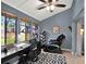 Inviting office space with large windows offering great natural light, desk, and massage chair at 1105 Woodbine St, Fern Park, FL 32730