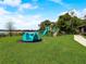 Fun playground with a merry-go-round and climbing structure for to enjoy outdoor activities at 1105 Woodbine St, Fern Park, FL 32730