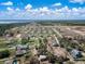 Vast aerial shot showcases numerous homes in a well-planned community near a highway and scenic natural areas at 1113 Caloosa Ridge Way, Babson Park, FL 33827