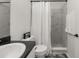 Modern bathroom with marble-tiled shower, white vanity, and complementary fixtures at 1113 Caloosa Ridge Way, Babson Park, FL 33827