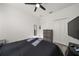 Spacious bedroom with a comfortable bed, modern dresser, and ample closet space, offering a serene and organized environment at 1113 Caloosa Ridge Way, Babson Park, FL 33827