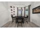 Cozy dining room with modern light fixture, seating for four, and stylish decor at 1113 Caloosa Ridge Way, Babson Park, FL 33827