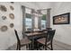 Inviting dining area featuring a rustic table, elegant decor, and natural light, perfect for Gathering gatherings at 1113 Caloosa Ridge Way, Babson Park, FL 33827