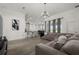 Open-concept living space connects the living room and kitchen, ideal for entertaining and daily living at 1113 Caloosa Ridge Way, Babson Park, FL 33827