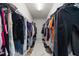 Spacious walk-in closet features custom shelving for clothing and shoes at 1113 Caloosa Ridge Way, Babson Park, FL 33827