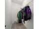 This walk-in closet features ample storage space, wire shelving, and sleek, modern design for optimal organization at 1113 Caloosa Ridge Way, Babson Park, FL 33827