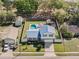 Aerial view of the home, showcasing the lawn, landscaping, two car driveway and location at 1189 Lazy Hollow Pl, Winter Park, FL 32792