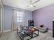 Spacious playroom with natural light, ceiling fan, and neutral carpet at 1189 Lazy Hollow Pl, Winter Park, FL 32792