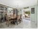 Elegant dining room with chandelier lighting and sliding doors to the patio at 1189 Lazy Hollow Pl, Winter Park, FL 32792