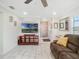 Bright living room with tile flooring, neutral walls, and ample natural light at 1189 Lazy Hollow Pl, Winter Park, FL 32792