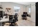Well-lit office area with two chairs, neutral floors, and a full-length mirror at 1189 Lazy Hollow Pl, Winter Park, FL 32792
