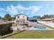 View of the backyard with in-ground pool, seating, gazebo and outdoor shed at 1189 Lazy Hollow Pl, Winter Park, FL 32792