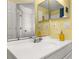 Bright bathroom featuring vanity with large mirror and modern chrome faucet on white basin at 121 Sonja Cir, Davenport, FL 33897