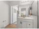 Bright bathroom features vanity, shower and large mirror at 121 Sonja Cir, Davenport, FL 33897