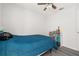 Bedroom boasts light wood flooring, fan, and window with toys and bookshelf at 121 Sonja Cir, Davenport, FL 33897