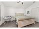 Bright main bedroom with a ceiling fan, neutral colors and ensuite bathroom at 121 Sonja Cir, Davenport, FL 33897