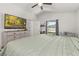 Spacious main bedroom features a ceiling fan, neutral colors and ensuite bathroom at 121 Sonja Cir, Davenport, FL 33897