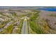 Aerial view of a planned community with clock tower, ponds, and manicured lawns at 14433 Pleach St, Winter Garden, FL 34787