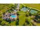Aerial view of Community amenities include a pool, a basketball court, and a tennis court at 14433 Pleach St, Winter Garden, FL 34787