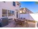 Backyard patio featuring a brick paver patio, with a dark table and 6 chairs at 14433 Pleach St, Winter Garden, FL 34787