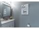 Cozy half bathroom featuring modern sink and decor at 14433 Pleach St, Winter Garden, FL 34787