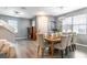 Bright and inviting dining area featuring LVP flooring, neutral paint, and stylish light fixture at 14433 Pleach St, Winter Garden, FL 34787