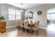 Inviting dining room featuring stylish light fixture and easy access to kitchen at 14433 Pleach St, Winter Garden, FL 34787
