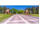 Entrance to a community with brick gatehouses on either side of the brick-paved street at 14433 Pleach St, Winter Garden, FL 34787
