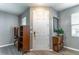 Inviting entryway with neutral paint, luxury vinyl plank flooring, and ample natural light at 14433 Pleach St, Winter Garden, FL 34787