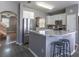 Well-equipped kitchen featuring stainless steel appliances and breakfast bar seating at 14433 Pleach St, Winter Garden, FL 34787