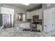 Kitchen featuring stainless appliances, granite counters, and ample cabinet space at 14433 Pleach St, Winter Garden, FL 34787