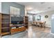 Open-concept living and dining area featuring luxury vinyl plank floors and lots of natural light at 14433 Pleach St, Winter Garden, FL 34787