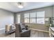 Cozy living room featuring LVP flooring, lots of light, and easy access to the backyard at 14433 Pleach St, Winter Garden, FL 34787