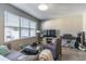 Bright living room featuring large windows, comfortable seating, and modern decor at 14433 Pleach St, Winter Garden, FL 34787