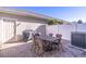 Cozy brick patio with outdoor dining set, grill, and white privacy fence at 14433 Pleach St, Winter Garden, FL 34787