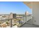 Stunning balcony view with modern glass railings overlooking the cityscape on a clear, sunny day at 150 E Robinson St # 2608, Orlando, FL 32801