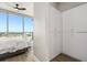 Bedroom closet showing ample storage and a view of the city outside the bedroom window at 150 E Robinson St # 2608, Orlando, FL 32801