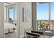View from seating area into bedroom with a beautiful cityscape visible through the floor to ceiling window at 150 E Robinson St # 2608, Orlando, FL 32801