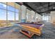 Spacious game room featuring a pool table, comfortable seating, and panoramic lake views at 150 E Robinson St # 2608, Orlando, FL 32801