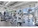 Bright gym with modern cardio machines and large windows overlooking the city skyline at 150 E Robinson St # 2608, Orlando, FL 32801