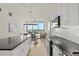 Modern kitchen showcasing stainless steel appliances, sleek cabinetry, and an open layout to the living space at 150 E Robinson St # 2608, Orlando, FL 32801