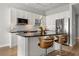 Bright kitchen with white cabinets, stainless steel appliances, a breakfast bar, and modern finishes at 150 E Robinson St # 2608, Orlando, FL 32801