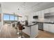 Modern kitchen featuring a breakfast bar, stainless steel appliances, and a beautiful view of the city at 150 E Robinson St # 2608, Orlando, FL 32801