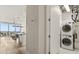 Laundry room with stackable washer and dryer units, offering convenience and functionality at 150 E Robinson St # 2608, Orlando, FL 32801