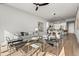 Spacious living room with modern furniture, an open floor plan, hardwood floors, and neutral walls at 150 E Robinson St # 2608, Orlando, FL 32801