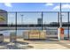 Outdoor kitchen area with a stainless steel grill and volleyball court background at 150 E Robinson St # 2608, Orlando, FL 32801