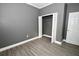 Bedroom with wood flooring and closet with white trim at 1508 W 16Th St, Sanford, FL 32771
