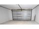 Spacious garage featuring a modern door, ready for vehicles and storage at 1508 W 16Th St, Sanford, FL 32771