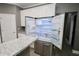 The kitchen features a stainless steel refrigerator with open doors next to counter at 1508 W 16Th St, Sanford, FL 32771