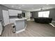 Modern kitchen island with granite countertops and stainless steel appliances at 1508 W 16Th St, Sanford, FL 32771